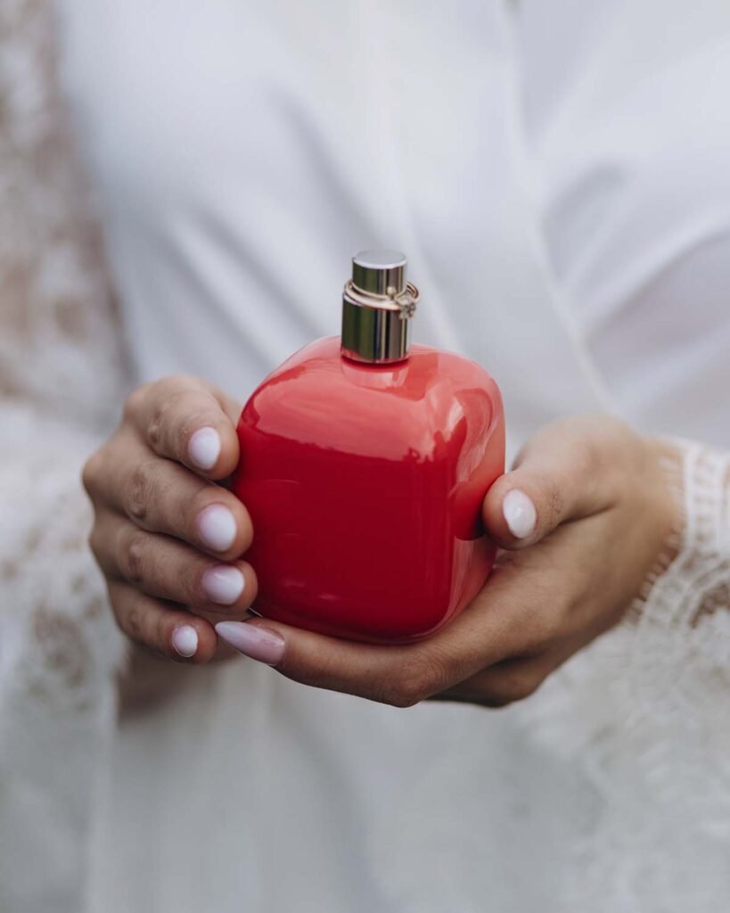 girl in a white dress sits and holds a bottle of p r43zm9y.jpg