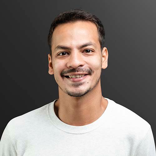 smiling man in white long sleeve tee portrait ynpwerg.jpg